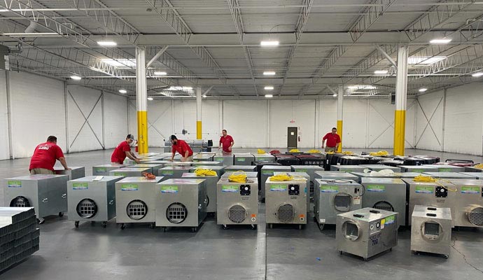 A group of technicians is organizing a large fleet of air scrubbers