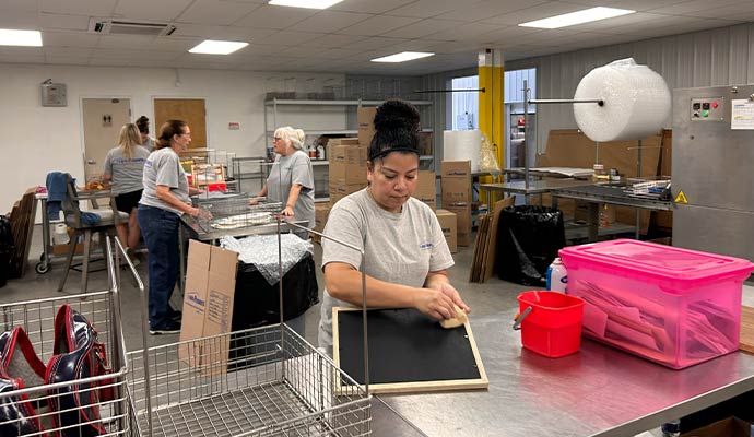 A team cleans contents in a facility.