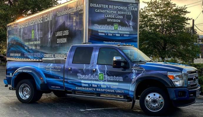 Teasdale Fenton Cleaning & Property Restoration service vehicle is parked outside