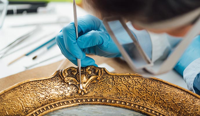A person restoring an antque item