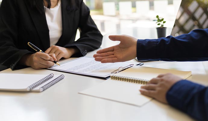 Two persons doing business contract meeting