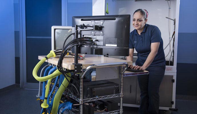 A technician is working on electronic device cleaning setup
