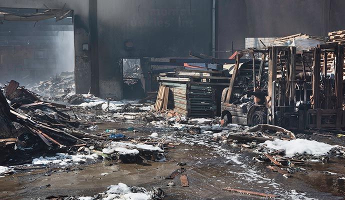 Fire damaged commercial property Fire damaged commercial property with collapsed and charred structure