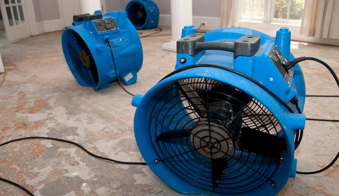 home water damage restoration with blue equipment