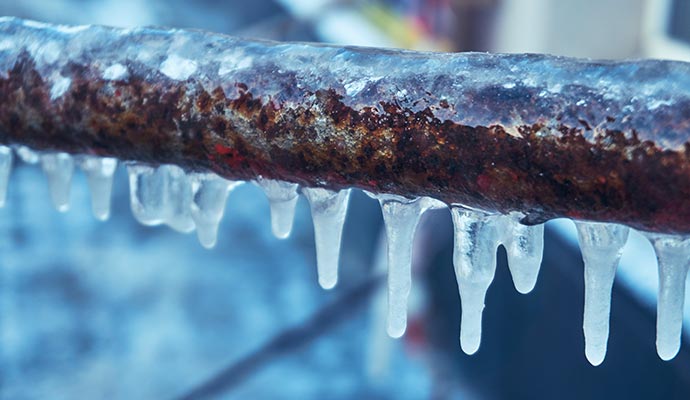 Leaked frozen pipe with icicles