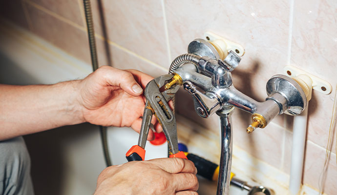 A faucet that is dripping water