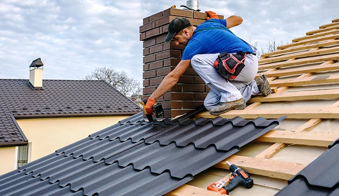 A professional installing new roof