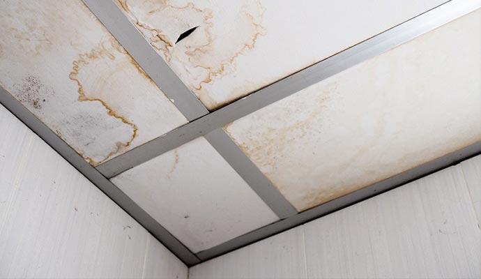 Wet ceiling water damage restoration