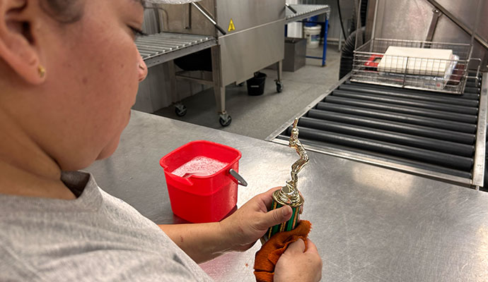 Woman cleaning a trophy